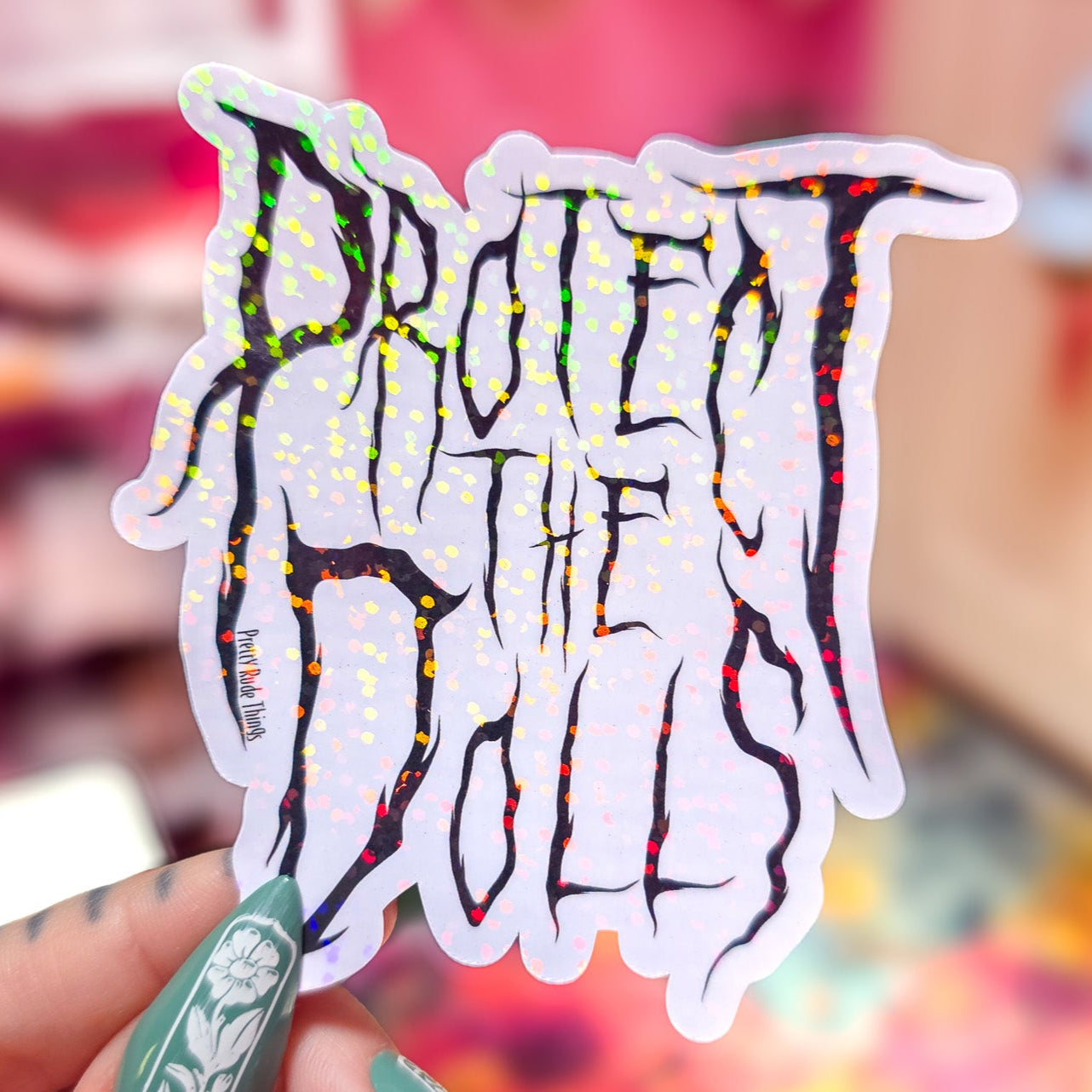 Protect The Dolls Metal Font Sticker, 3.1 x 3.2 in.
