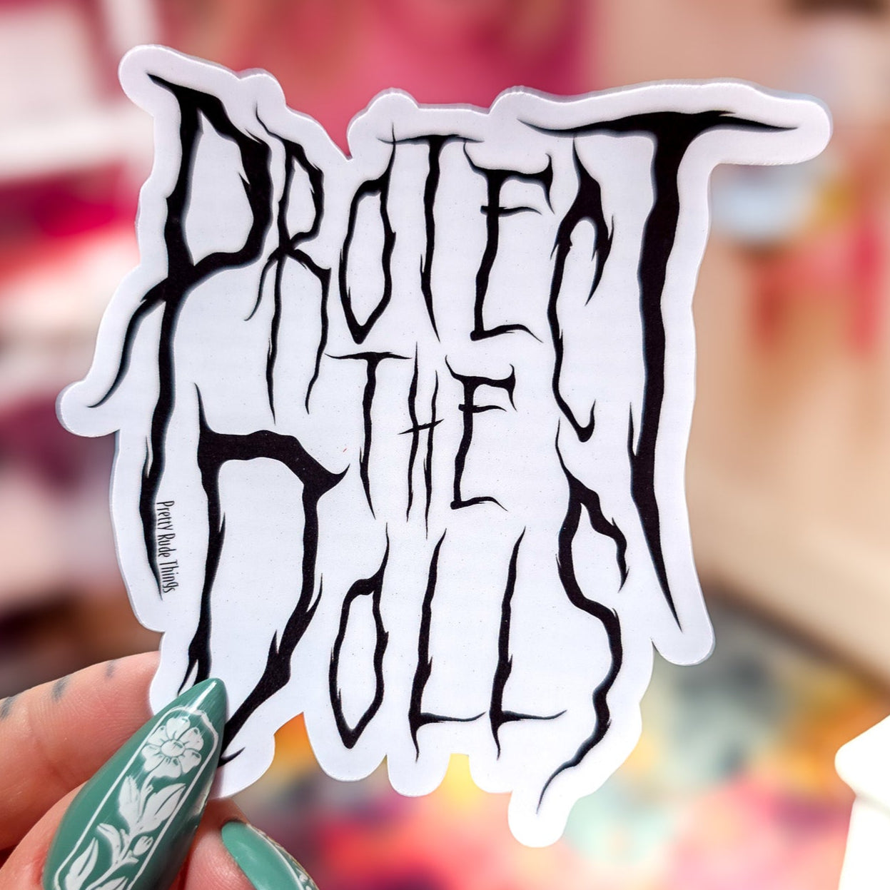 Protect The Dolls Metal Font Sticker, 3.1 x 3.2 in.